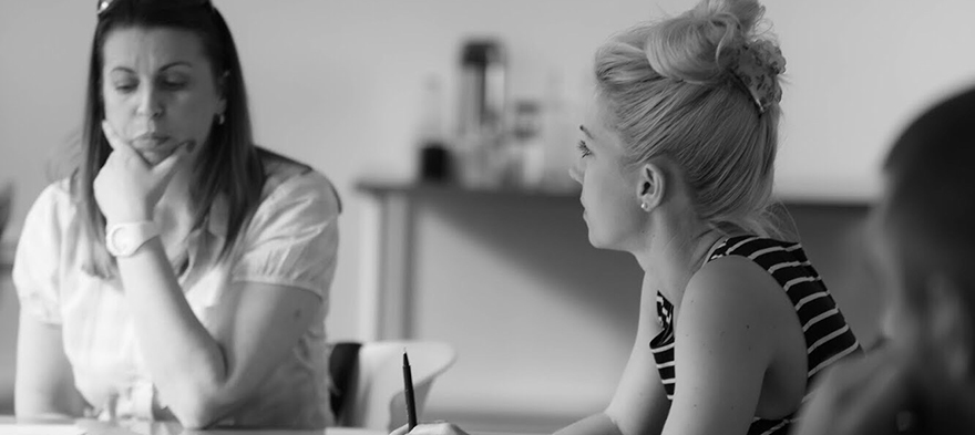 Two white women have a discussion