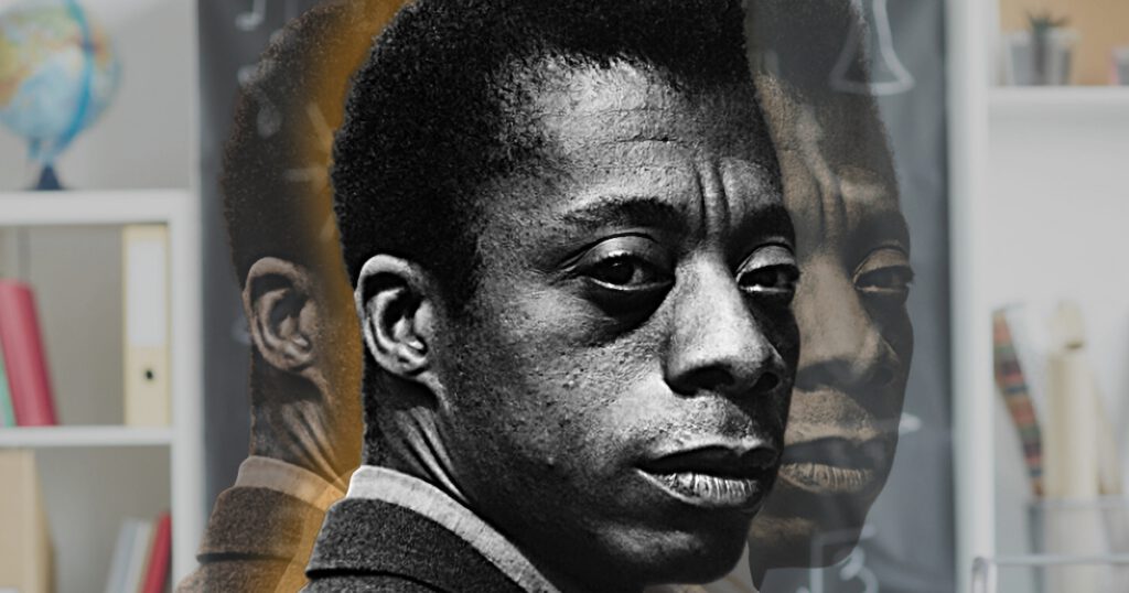 James Baldwin in front of book shelves