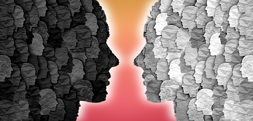 Graphic profile of a dark face and a light face facing each other on a sunset colored background