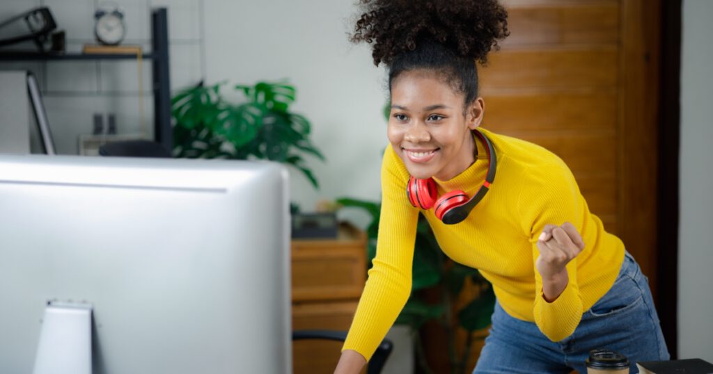 A young Black woman is learning remotely