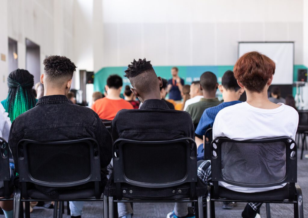 Students in a classroom. Photo by Sam Balye on Unsplash.