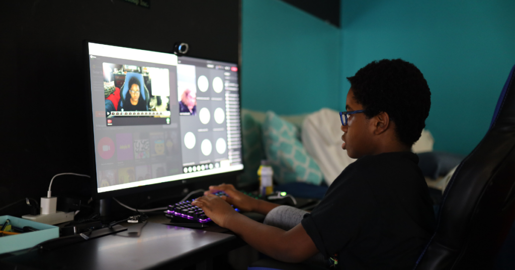 student doing work at a computer.