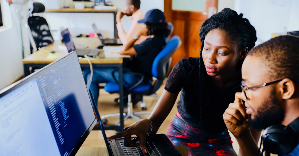Two Black students sitting in front of a computer
