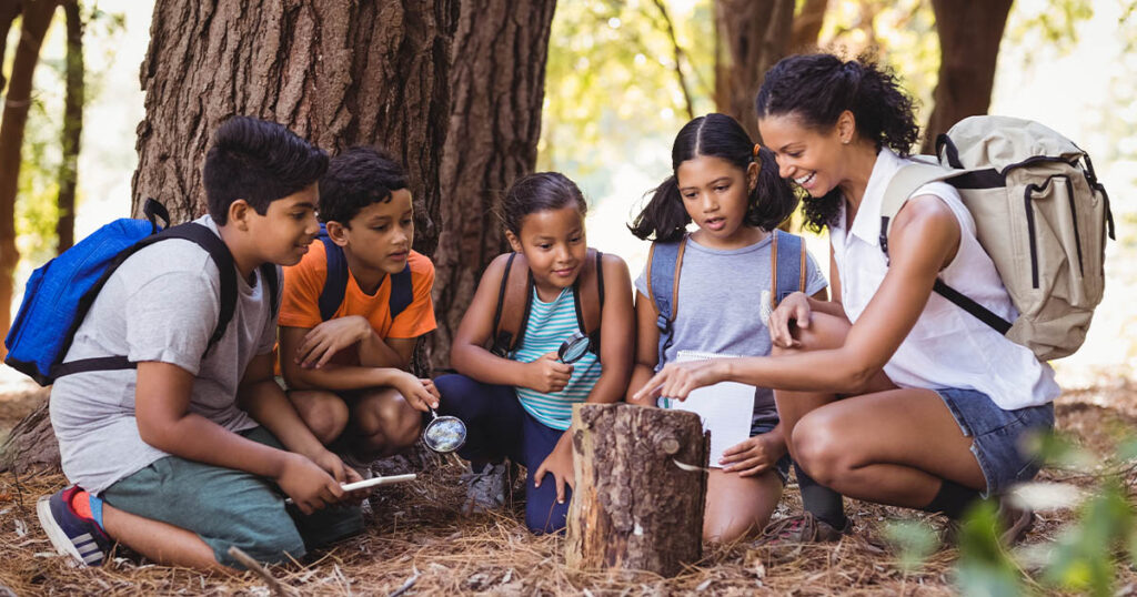 Children sitting together outside