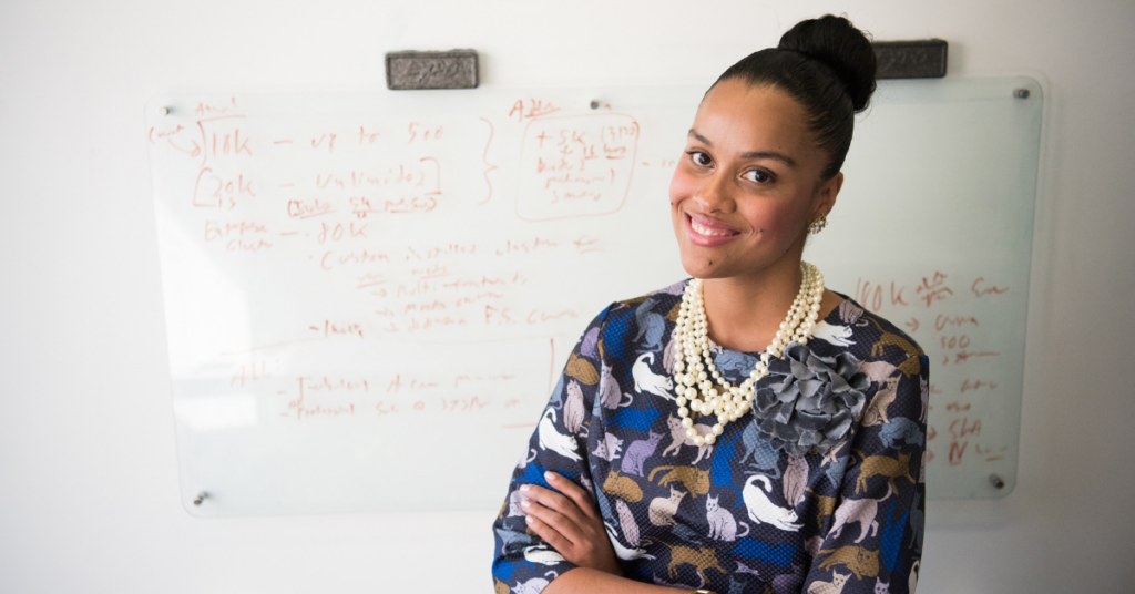 Black woman teacher at the front of her class. Photo by Christina @ wocintechchat.com on UnSplash.