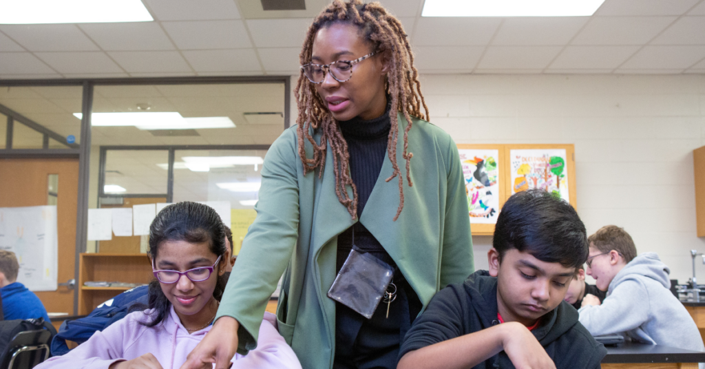 Teacher giving classroom instruction.