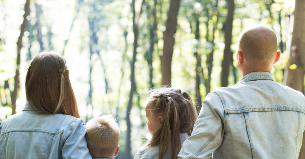 Parents with their children at a park.