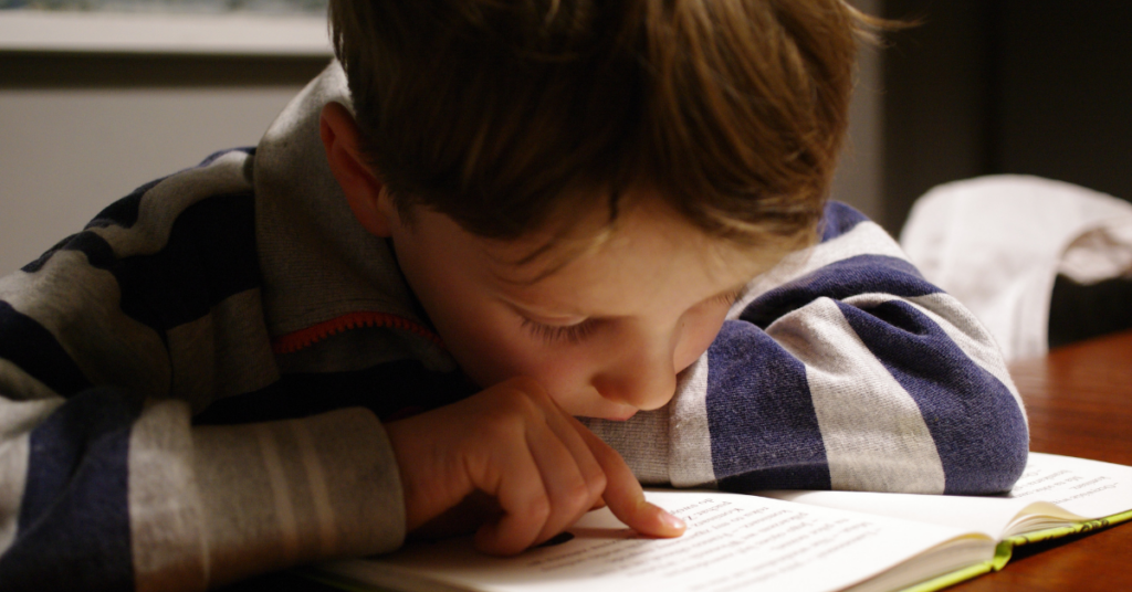 young child learning to read.