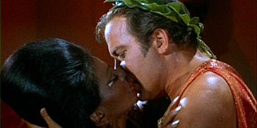 Captain Kirk and Lieutenant Uhura kissing
