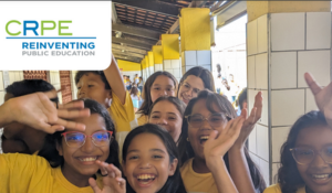 Smiling girls from Sobral with the CRPE logo in the upper left corner