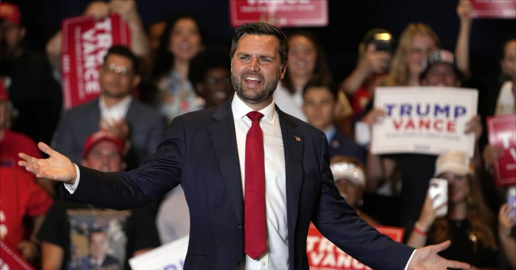 Senator JD Vance speaking to a crowd at a political rally, 2024