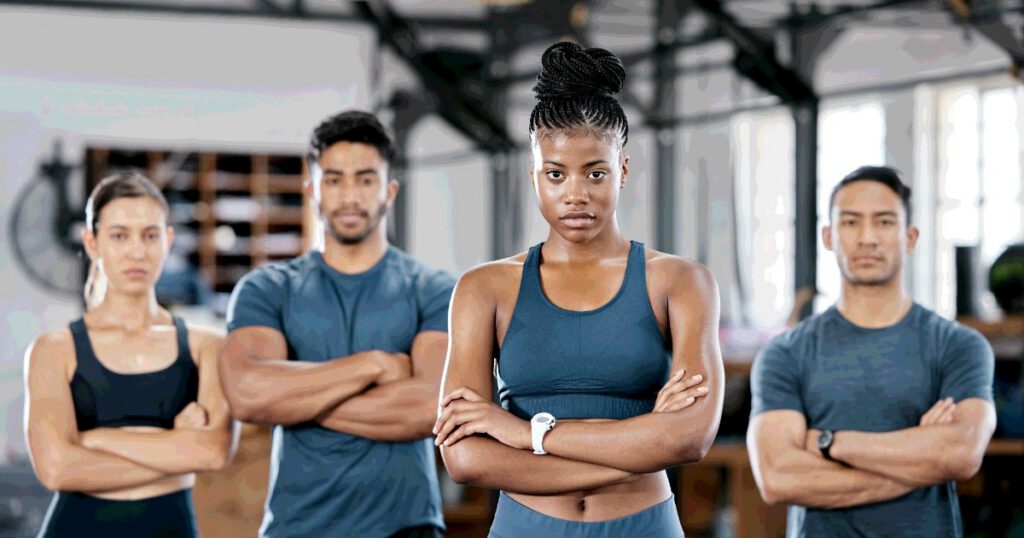 Diverse group of young people in a gym after a crossfit workout