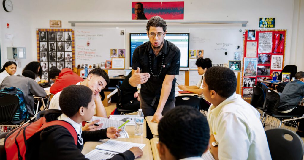 Ismael Jimenez teaching a group of students in a classroom