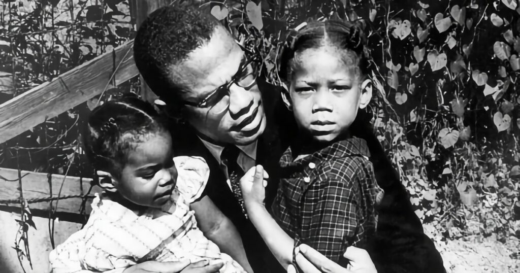 Malcolm X with two daughters