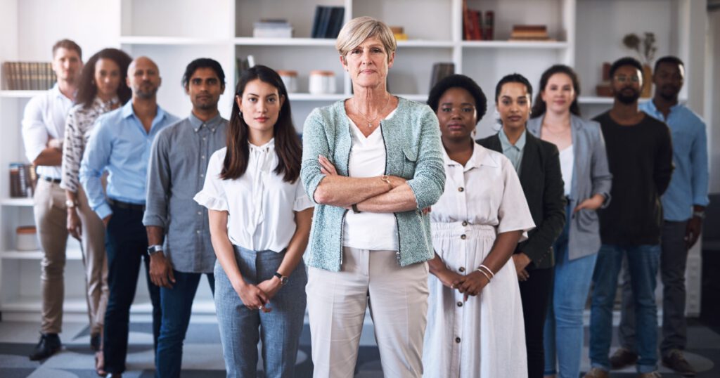 Portrait of a diverse group of teachers standing together in an office