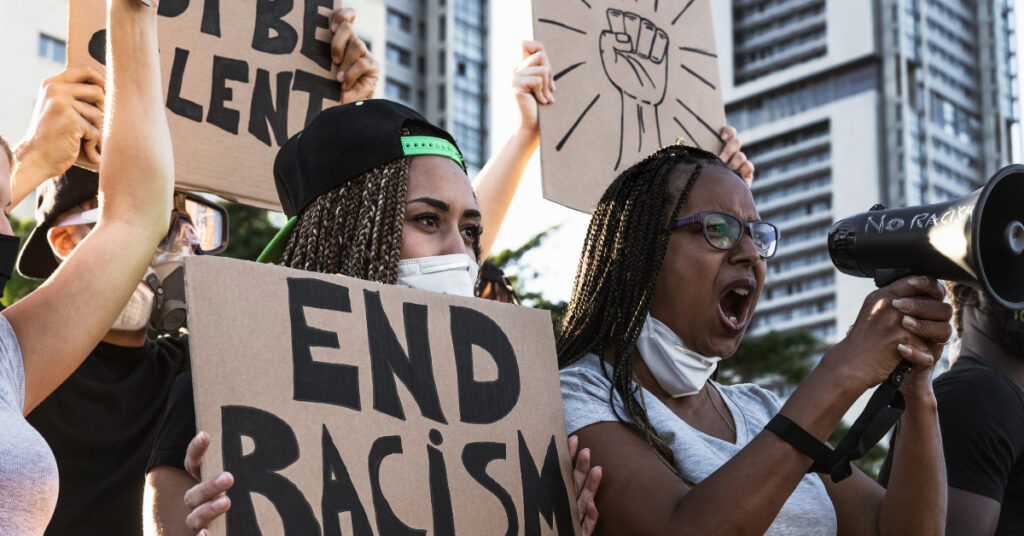 Activist movement protesting against racism and fighting for equality - Demonstrators from different age and race manifesting for equal rights - Black lives matter street city protests concept
