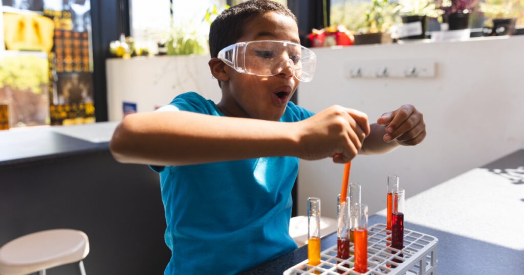 Biracial boy engages in a science experiment